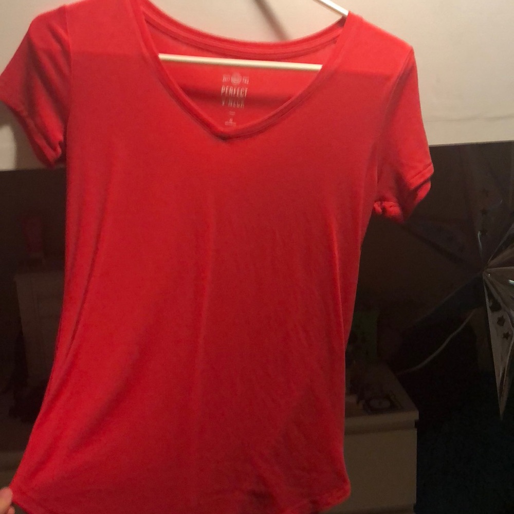 orangish shirt